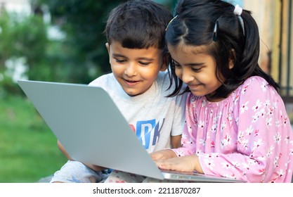 Rural Area Kid Using Laptop Internet Watching Online Video.