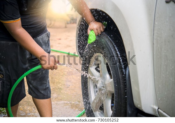 Rural boys are hired to wash\
cars.