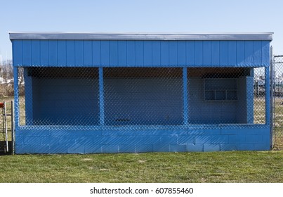 Rural community wooden baseball dugout. Simple sparse.
