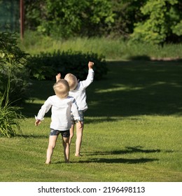 RURAL COUNTY, SWEDEN ON JUNE 24. Two Kids Look Up Into The Sky For A UFO On June 24, 2022 In A Rural County, Sweden. A Strange Sound Is Heard.