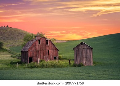 Rural Farm Scene At Sunset With Red Barn Viewed From The Palouse In Washington State