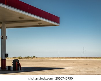 Rural gas station on the edge of vast farmland. Refueling on a road trip with friends across the United States of America. - Shutterstock ID 2050743950