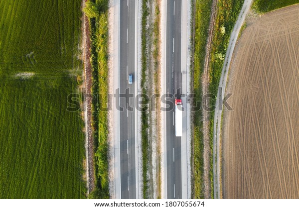 Rural highway with cars.\
Top view . 