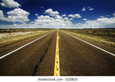 Rural Highway Heads Off To The Vanishing Point.