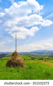 Rural idyllic view with haystack.