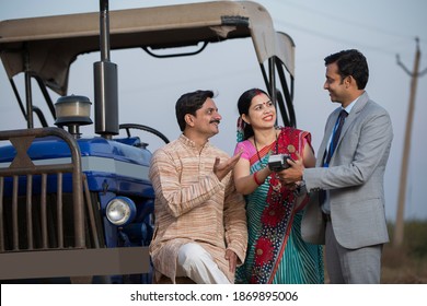 Rural Indian Couple Using Digital Payment