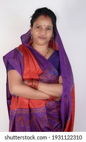 A rural indian woman posing to camera indoor