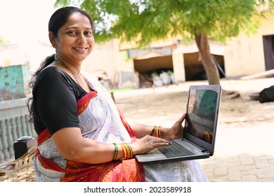 Rural Indian Woman Using Laptop At Village