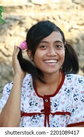 Rural Indonesian Woman Two Braids Smiling Looking At The Camera