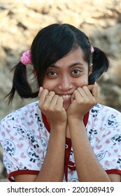 Rural Indonesian Woman Two Braids Smiling Looking At The Camera