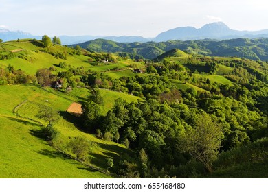 A rural landscape of green farm fields and country hillsides - Shutterstock ID 655468480