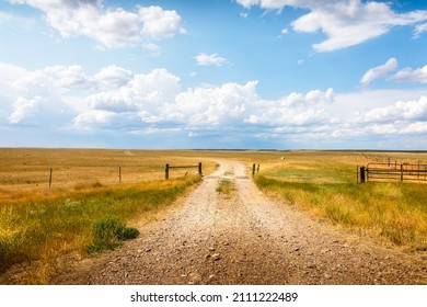 Rural Landscape In Montana With A Summer Meadow Behind A Fence