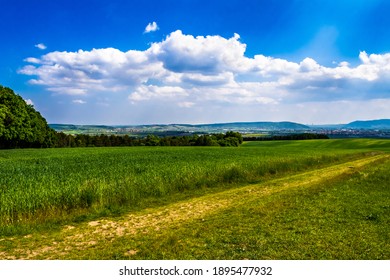 Rural Landscape With Sunlit Clouds In Front Of The Skyline Of Vienna In Austria - Shutterstock ID 1895477932