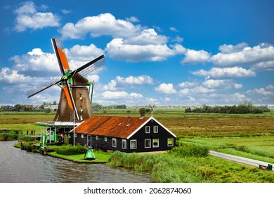 Rural landscape with windmill in Zaanse Schans. Holland, Netherlands. Authentic Zaandam mill. Beautiful Netherland landscape. 