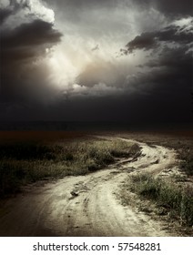 Rural Road And Dark Storm Clouds