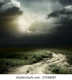 Rural Road And Dark Storm Clouds