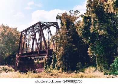 Rural scene, rusty railroad bridge in Jefferson, Texas - Powered by Shutterstock