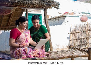 Rural Woman Using Laptop At Village