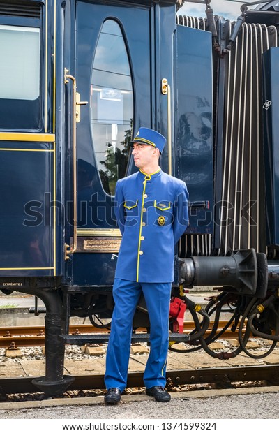 Ruse city, Bulgaria - August 29, 2017. The\
legendary Venice Simplon Orient Express is ready to depart from\
Ruse Railway station. Chief wagon. The luxury train travels between\
Paris and Istanbul.