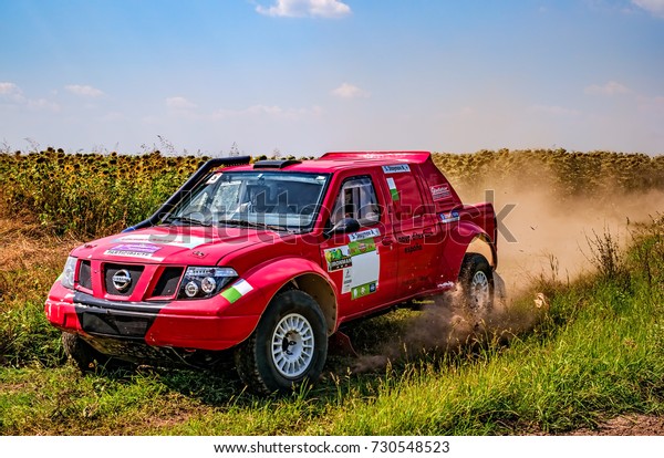 Ruse district,\
Bulgaria - July 21, 2017. Ivanovo village area, Ruse region,\
Bulgaria, Red rally car in\
action