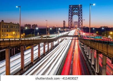 Rush hour traffic with light trails on George Washington Bridge, in New York City - Shutterstock ID 411403027