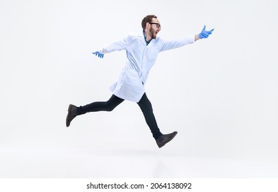 Rushing scientist. Portrait of running man, chemist, doctor in motion isolated on white background. Concept of healthcare, pharmaceuticals, medicine. Copy space for ad. Looks in a hurry, puzzled - Powered by Shutterstock