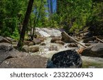 The rushing water of Carlon Falls cascades around and over boulders after peak snowmelt. Carlon Falls, in YNP, is fed by the south fork of the Tuolumne River and is a popular hiking destination. 