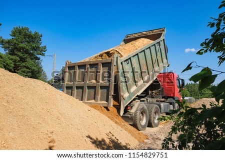 rusovich pours sand on the construction site