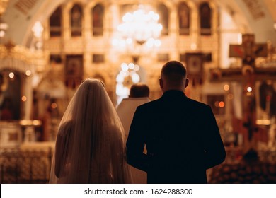 Russia, 2020 Orthodox Church, Sacrament Of A Wedding Ceremony, Couple, Priest, Golden Church Interior, Candles, Icons, Altar, Prayer
