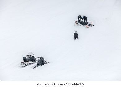 Russia, Adygea, Lago Naki, February 21, 2013: BRP Snowmobile Stuck In Deep Snow On A Mountainside.