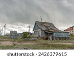 Russia, Arctic, Kola Peninsula, Teriberka. Run down abandoned wooden houses. An abandoned old village
