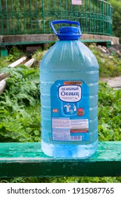 Russia - August 19, 2020. Plastic bottle with holy water from the Okovetsky holy spring. The Holy key. Okovetsky holy spring. Okovtsy, Selizharovsky district, Tver region, Russia.