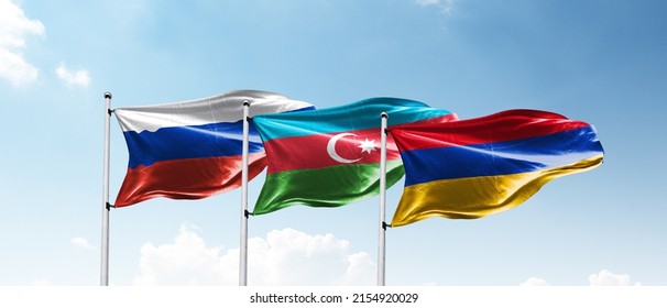 Russia, Azerbaijan And Armenia Flags On Sky.