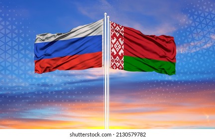 Russia and Belarus flag waving in the wind against white cloudy blue sky together. Diplomacy concept