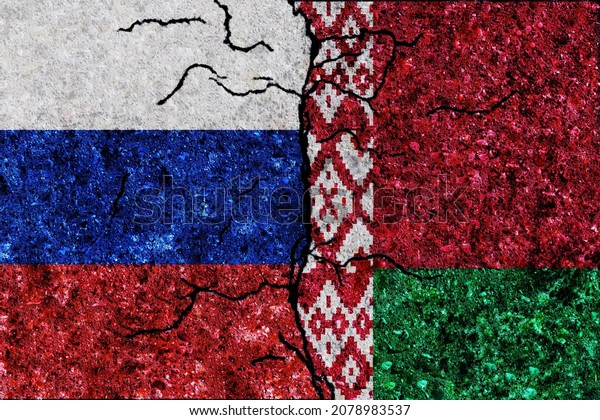 Russia and Belarus painted flags on a wall with\
grunge texture. Russia-Belarus conflict. Russia and Belarus flags\
together