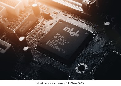 Russia, Berdsk - 17 Feb 2021: Intel Computing Chip On An Old Motherboard. Old Electronics Close-up. Chip ICS. Electronic Background. Selective Focus