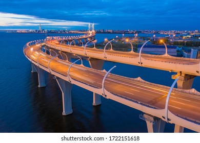 Russia. Bridges Of Saint Petersburg. The road through the Gulf of Finland. The River Neva. Modern highway. Road bridge at dawn. Industrial district of Petersburg. Panorama of the city from a height