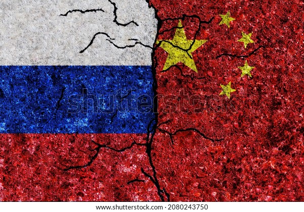 Russia and China painted flags on a wall with\
grunge texture. China and Russia conflict. Russia and China flags\
together. Russia vs\
China