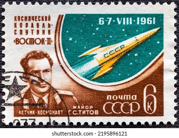 RUSSIA - CIRCA 1961: Stamp Printed By Russia, Shows Major Titov, Globe With Orbit And Cosmonaut, Circa 1961.