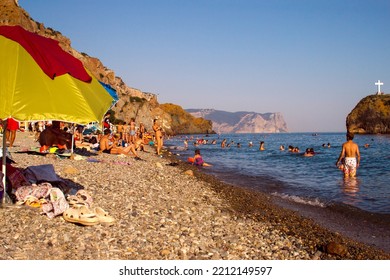 Russia, Crimea, July 16, 2021: Vacationers On Jasper Beach. Resort On Summer Season