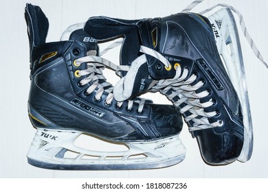 Russia, Dzerzhinsk, Nizhny Novgorod Region, September 18, 2020.
 Used Bauer Supreme Ice Hockey Dark Skates - Visible Scuffs And Scratches From Professional Ice Hockey, Photo Against A Light Background