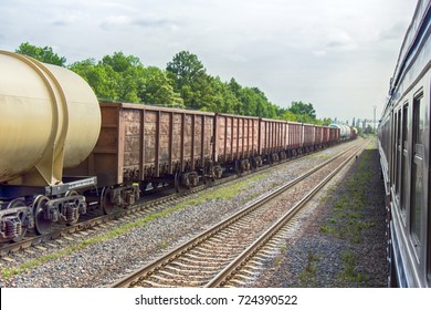 Russia. Electric Trains And Freight Train. Cars Filmed In Spatial Perspective