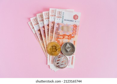 Russia exchanges money for cryptocurrency. Exchange of rubles for bitcoin, ethereum. A new way to invest money. Litecoin coins are on paper money. High quality photo