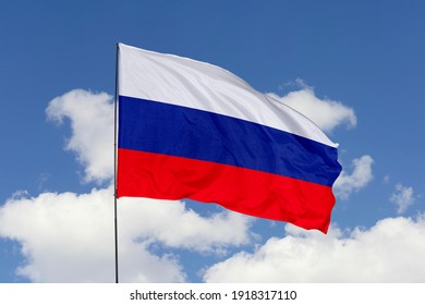 Russia flag isolated on the blue sky with clipping path. close up waving flag of Russia. flag symbols of Russia. - Shutterstock ID 1918317110