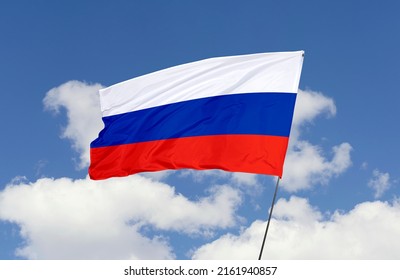 Russia flag is isolated on the blue sky with a clipping path. flag symbols of Russia. - Shutterstock ID 2161940857