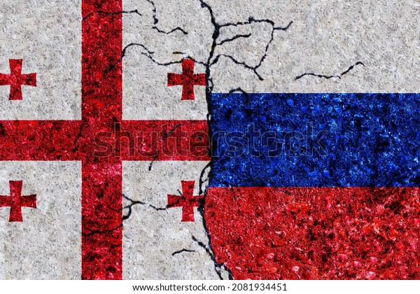 Russia and Georgia painted flags on a wall with\
grunge texture. Russia and Georgia conflict. Georgia and Russia\
flags together. Russia vs\
Georgia