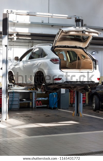 Russia,\
Izhevsk - April 21, 2018: Automobile workshop. Scheduled\
replacement and wheel alignment in workshop\
car.