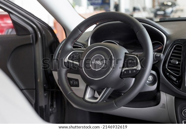 Russia,\
Izhevsk - March 4, 2022: Jeep showroom. Interior of new modern\
Compass off-road vehicle in dealer showroom. Alliance Stellantis.\
Modern transportation. Famous world\
brand.