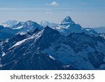 Russia. Kabardino-Balkaria. A dizzying view of the mountain peaks of the Caucasus around Mount Elbrus (5,642 m) - the highest mountain in Russia and Europe.