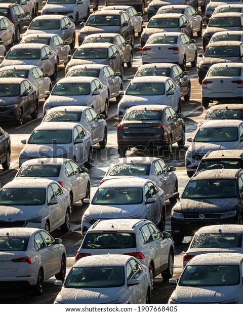 Russia, Kaluga -\
NOVEMBER 12, 2020: Rows of new cars parked in a factory or\
dealership parking lot on a sunny\
day.